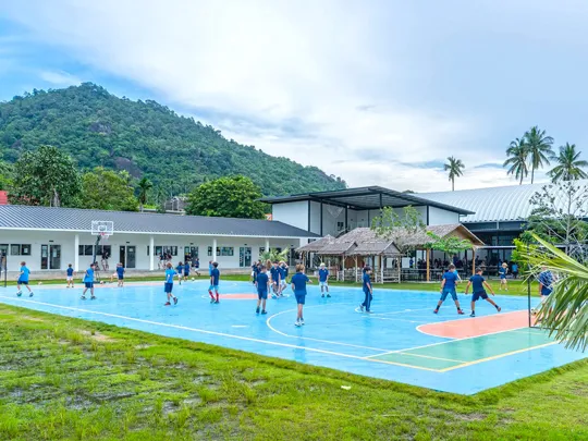 Photo of an outdoor sports court at the Windfield International School.