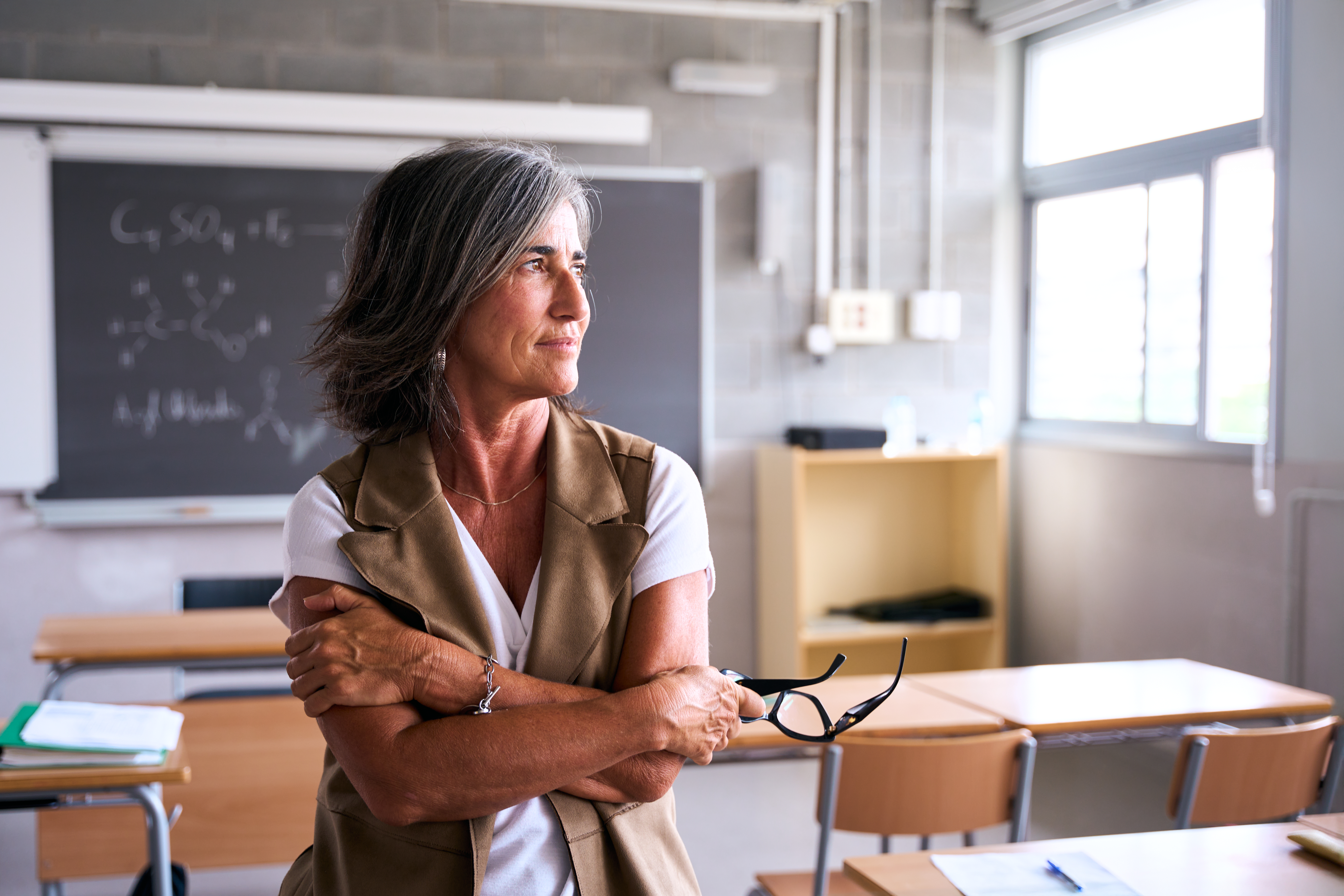 Teacher looking away in thought. 