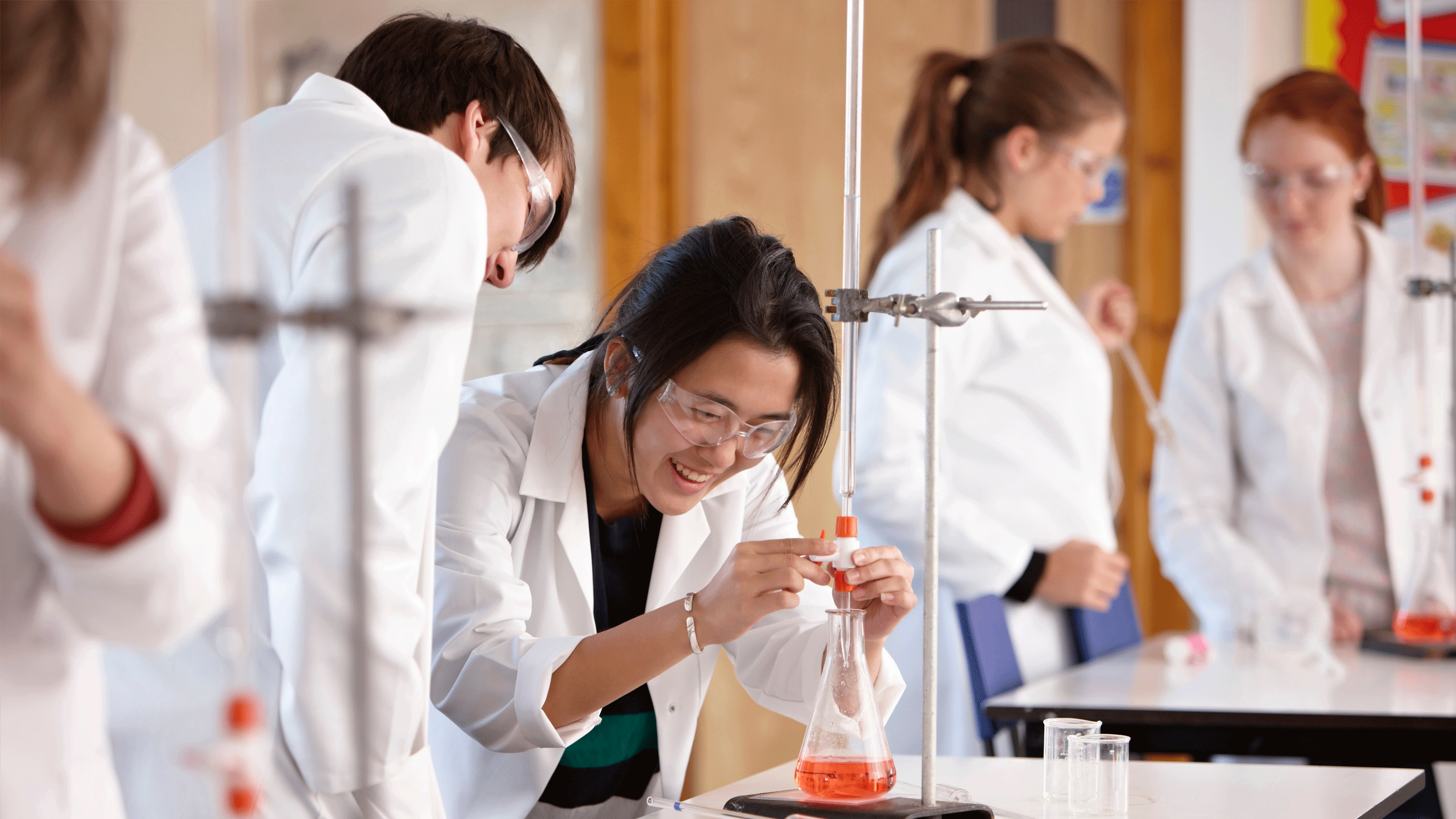 Student conducting a chemistry experiment. 