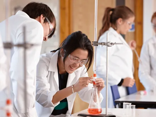 Student conducting a chemistry experiment.